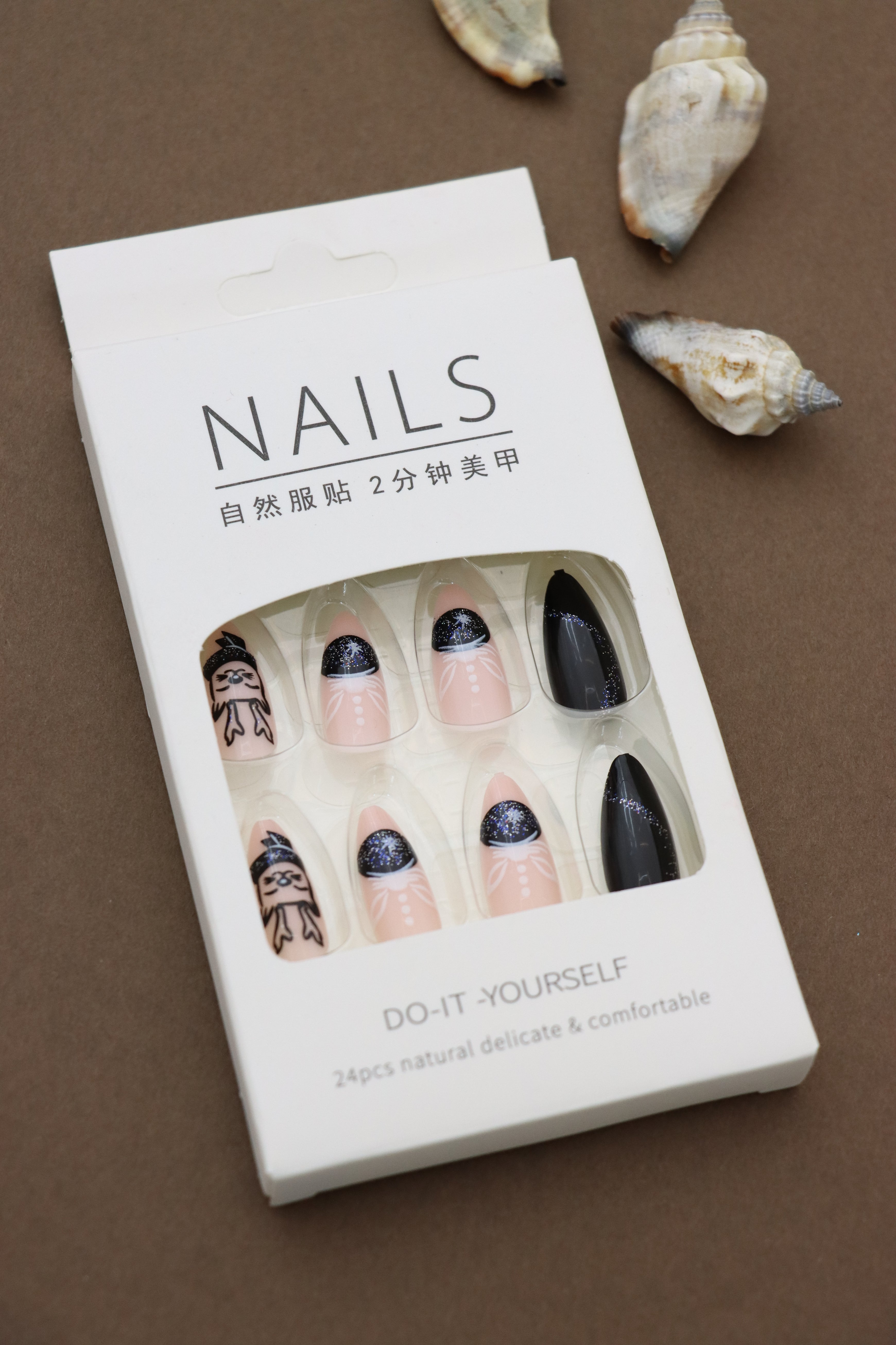 Black and Nude Almond Press-On Nails with Glitter and Chic Art Designs