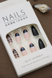 Black and Nude Almond Press-On Nails with Glitter and Chic Art Designs